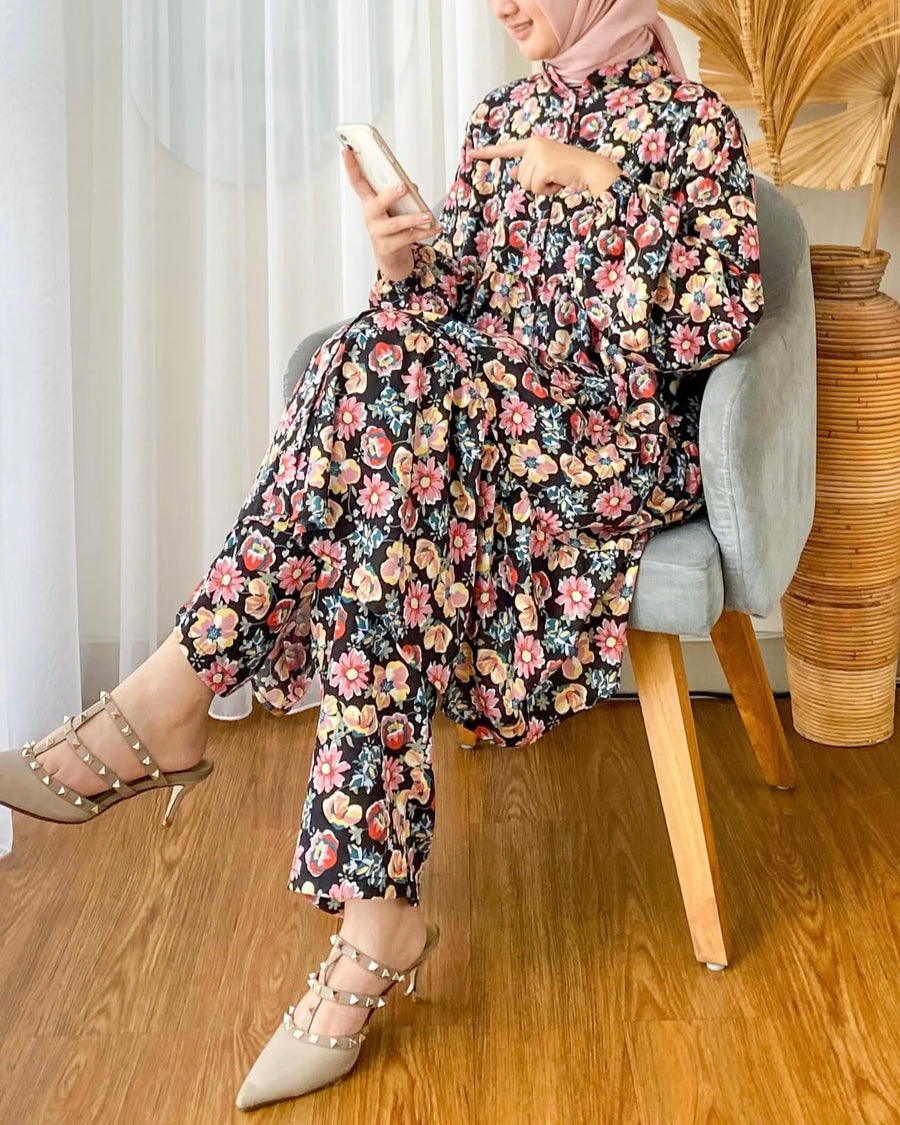 Model seated wearing the Midnight Floral co-ord set